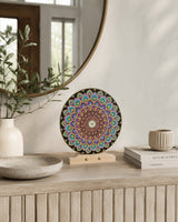Aurum Bloomless round dot mandala artwork displayed on a timber stand atop a light console table by Sweet Lilly Loves