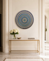 Azure Rhythm round dot mandala wall art displayed above a slim timber console in a bright hallway by Sweet Lilly Loves