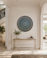 Azure Rhythm original round mandala artwork displayed above a timber console table in a bright entryway by Sweet Lilly Loves