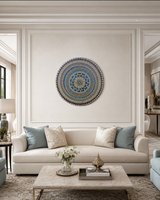 Azure Rhythm original hand-painted mandala artwork displayed above a light neutral sofa in an elegant living room by Sweet Lilly Loves