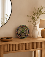 Hearts Sunset original hand-painted mandala artwork displayed on a timber console beneath a round mirror by Sweet Lilly Loves