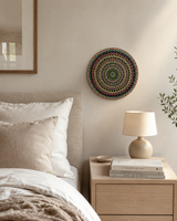 Hearts Sunset green, yellow and gold dot mandala artwork displayed above a bedside table in a calm neutral bedroom by Sweet Lilly Loves