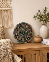 Hearts Sunset hand-painted dot mandala artwork displayed above a timber bedside table in a warm bedroom setting by Sweet Lilly Loves