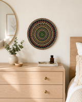 Hearts Sunset original green, yellow, gold and copper mandala artwork displayed above a light timber chest of drawers by Sweet Lilly Loves