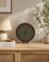 Hearts Sunset round dot mandala artwork displayed on a timber console beside books and neutral decor by Sweet Lilly Loves