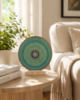 Golden Radiance original round mandala artwork displayed on a small side table in a bright neutral room by Sweet Lilly Loves