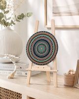 Copper Jewel original hand-painted mandala artwork displayed on a small easel in a light neutral interior by Sweet Lilly Loves
