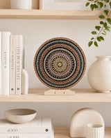 Crown of Echoes original hand-painted mandala artwork displayed on a shelf with books and neutral decor by Sweet Lilly Loves