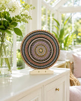 Crown of Echoes hand-painted dot mandala artwork displayed on a stand on a bright console table by Sweet Lilly Loves