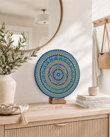Divine Tide of Gold blue and gold dot mandala artwork displayed on a timber stand on a styled dresser by Sweet Lilly Loves