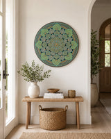 Echoes in Gold original round mandala artwork displayed above a small console table in a light neutral room by Sweet Lilly Loves