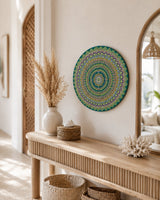Emerald Echo Aurelia round dot mandala artwork displayed on a light console beneath an arched mirror by Sweet Lilly Loves