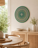 Emerald Echo Aurelia original hand-painted mandala artwork displayed on a stand in a bright dining space by Sweet Lilly Loves