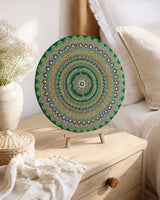 Emerald Echo Aurelia original hand-painted mandala artwork displayed on a bedside table in a calm bedroom setting by Sweet Lilly Loves