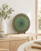 Golden Eclipse original round mandala artwork displayed on a timber cabinet in a soft neutral interior by Sweet Lilly Loves