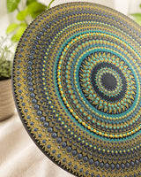 Detailed close-up of Golden Eclipse circular teal, gold and black dot mandala artwork by Sweet Lilly Loves