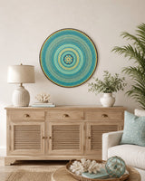 Inner Pulse original round mandala artwork displayed above a timber dresser in a light neutral room by Sweet Lilly Loves