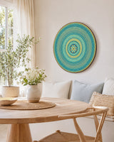 Inner Pulse turquoise and gold dot mandala wall art displayed above a small dining table by Sweet Lilly Loves