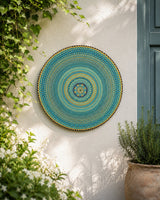 Inner Pulse original hand-painted mandala artwork displayed on a sunlit outdoor wall with greenery by Sweet Lilly Loves