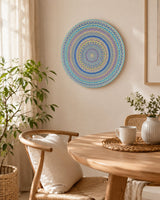 Ocean Whisper hand-painted mandala artwork displayed above a small round table in a light neutral interior by Sweet Lilly Loves