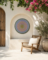 Radiant Pulse colourful dot mandala wall art displayed in a bright courtyard seating area by Sweet Lilly Loves