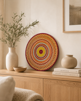 Sunset Warm Winter Fire hand-painted orange and gold dot mandala artwork displayed on a timber dresser by Sweet Lilly Loves