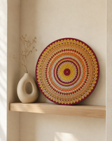 Sunset Warm Winter Fire original dot mandala artwork displayed on a small wall shelf in a softly lit neutral room by Sweet Lilly Loves