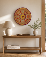 Sunset Warm Winter Fire original hand-painted mandala artwork displayed above a slim timber console table by Sweet Lilly Loves