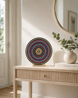 The Happy Centre original hand-painted mandala artwork displayed on a stand on a light console with neutral decor by Sweet Lilly Loves