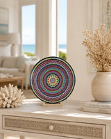 The Happy Centre original dot mandala artwork displayed on a stand on a light console near a bright window by Sweet Lilly Loves