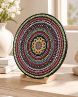 Close-up detail of The Happy Centre original colourful dot mandala artwork on a wooden stand by Sweet Lilly Loves
