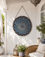 The Opulent Eye blue and pink dot mandala artwork displayed hanging in a bright arched space by Sweet Lilly Loves