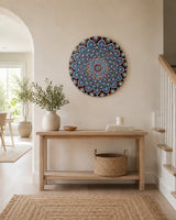 The Opulent Eye hand-painted dot mandala wall art displayed above a slim timber console in a bright arched hallway by Sweet Lilly Loves