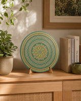 Verdant Glow round dot mandala artwork displayed on a timber shelf with books and decor by Sweet Lilly Loves