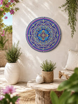 Vivid Devotion original blue and purple and gold dot mandala wall art displayed on a bright courtyard wall by Sweet Lilly Loves