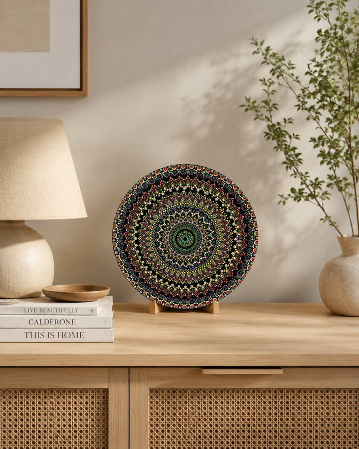 Hearts Sunset original green, gold and copper dot mandala artwork displayed on a timber console in a soft neutral interior by Sweet Lilly Loves